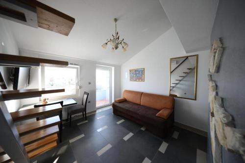 a living room with a couch and a table at Villa Eni in Bibinje
