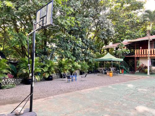 a basketball hoop in front of a house at Rio Danta Hostel in Fortuna