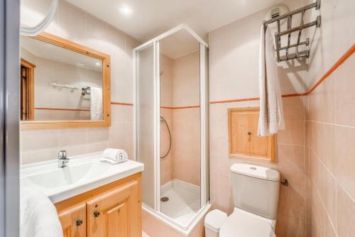 a bathroom with a toilet and a sink and a shower at Chalet Gypaete - Chalets pour 14 Personnes 881 in Tignes