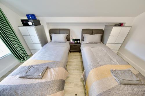 two beds sitting next to each other in a room at Mary St House 3B in Dublin