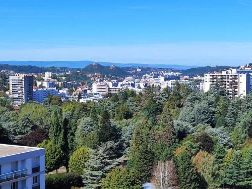 a view of a city with buildings and trees at F4 neuf in Saint-Étienne