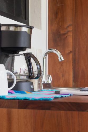a coffee maker sitting on top of a kitchen counter at Maison Bacalar in Bacalar