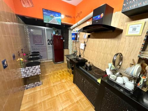 a kitchen with a sink and a counter top at zooFamily in Dhaka