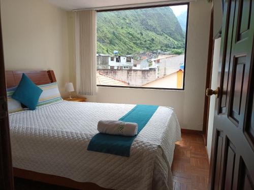 Postel nebo postele na pokoji v ubytování Hostal Monte Carmelo