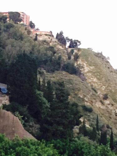a hill with trees on the side of it at Holiday Home Gionny & Mary in Taormina