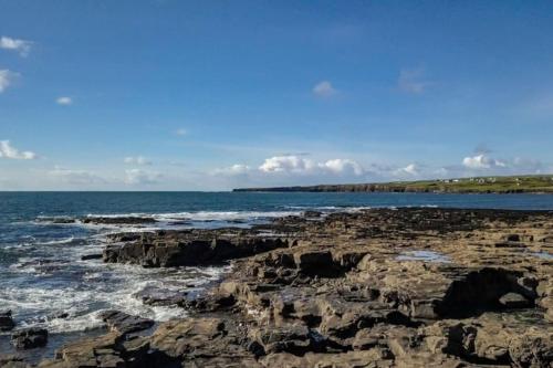 a view of the ocean from a rocky beach at Mullally House Liscannor (Wild Atlantic Way) in Liscannor