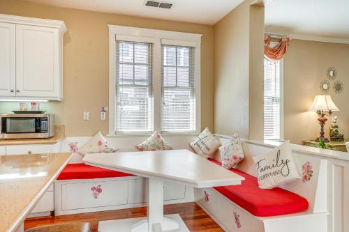 a kitchen with a white table and red chairs at Luxe Bay View Home Near SF, Berkley and Napa Valley in Hercules