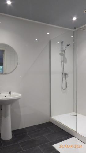 a bathroom with a shower and a sink at Ashiana in Newark-on-Trent