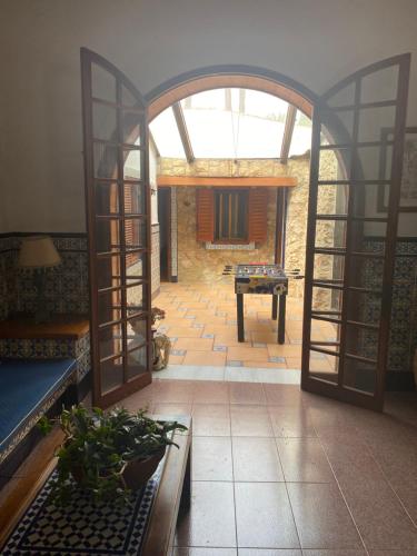 an open doorway to a room with a pool table at Pink Lemon House in Elche