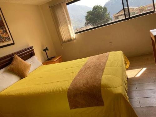 Hostal Monte Carmeloにあるベッド