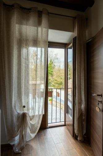 a room with a sliding glass door to a balcony at Fattoria F.lli Marsolo in Chiusa Sclafani