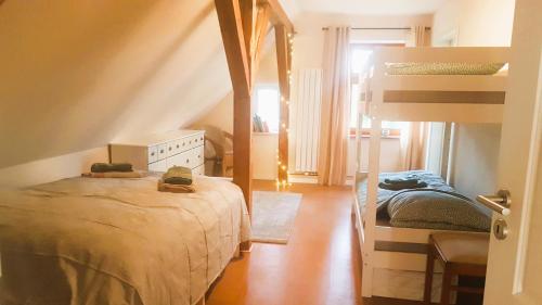 a bedroom with two beds and a bunk bed at Ferienhaus Salvia in Gremersdorf