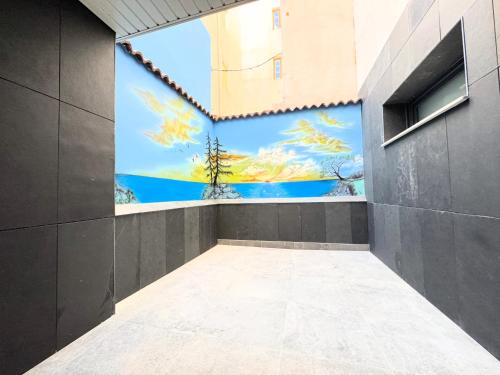 a room with a mural on the wall at Apartamentos Identia Sport by gaiarooms in León