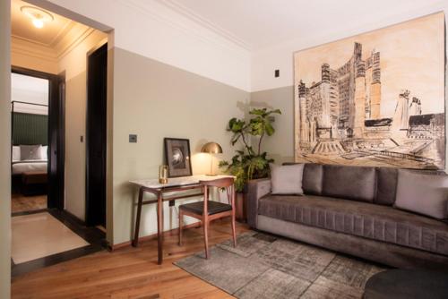 a living room with a couch and a table at Hotel Edificio Republica in Mexico City