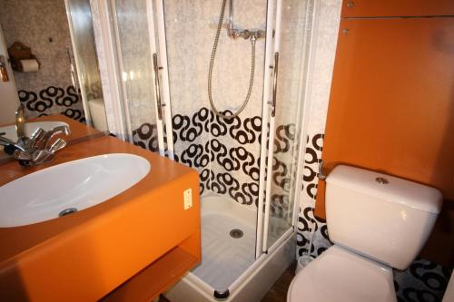 a bathroom with a shower and a toilet and a sink at Résidence Palafour - Studio pour 2 Personnes 361 in Tignes