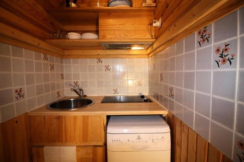 a small kitchen with a sink and a toilet at Résidence Palafour - Studio pour 2 Personnes 371 in Tignes
