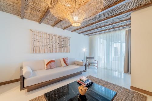 a living room with a couch and a table at Hotel Indigo La Paz Puerta Cortes, an IHG Hotel in La Paz