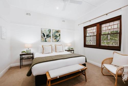 a bedroom with a large bed and a window at 'Haylock' Luxe Country Charm in Mudgee's Centre in Mudgee
