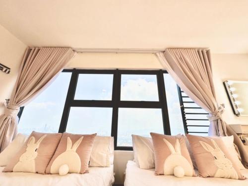a bedroom with a bed with a large window at Arte Cheras, Kuala Lumpur 3 Room x 8 pax KLCC Nice View Karaoke with BathTub in Kuala Lumpur