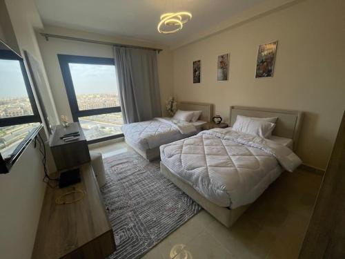 Postel nebo postele na pokoji v ubytování Unique duplex hotel apartment pool view