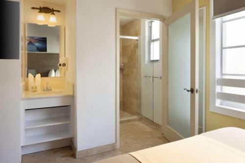 a bathroom with a sink and a shower at Ocean Five Hotel in Miami Beach