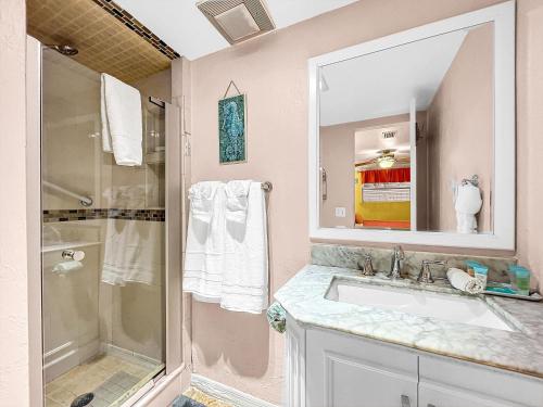 a bathroom with a sink and a shower at Paradise Cove at Island Getaway in Bradenton Beach