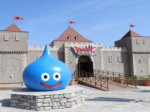 a large blue ball in front of a castle at KAMENOI HOTEL Awajishima in Awaji