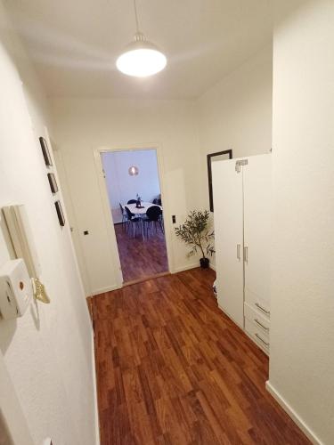 a room with a table and a dining room at Stylish Apartment On Pedestrian Street Randers in Randers