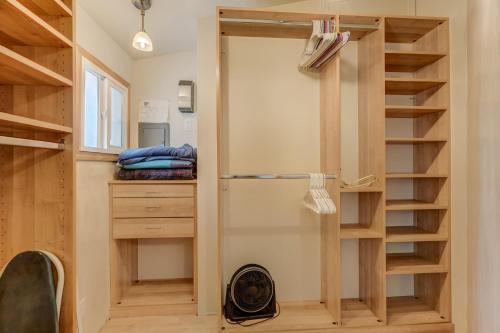 a tiny house with a closet and a staircase at 4BR Colorado Get Away With Gym! in Colorado Springs