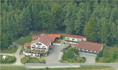 an aerial view of a large house in the woods at Landhotel Waldesruh in Furth im Wald