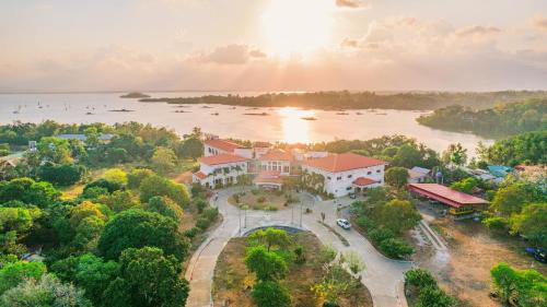 an aerial view of a house on the water at Hotel Palacio Puerto Princesa in Puerto Princesa City