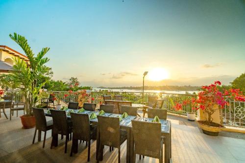 a restaurant with a table and chairs on a patio at Hotel Palacio Puerto Princesa in Puerto Princesa City