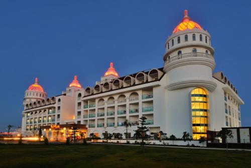 a large white building with a domed roof at Side Crown Serenity All Inclusive in Side