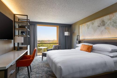 a hotel room with a large bed and a desk at Marriott El Paso in El Paso