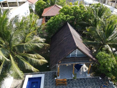 an overhead view of a house with palm trees at Sharick Beach House in Tubará