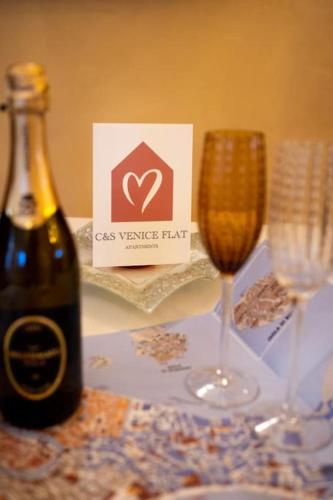 a bottle of wine and a glass on a table at cs veniceflat Apartment - Venice - Apt Vce - 15' from Venice in Tessera