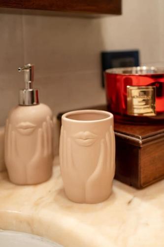 a bathroom counter with a toothbrush and a cup on it at cs veniceflat Apartment - Venice - Apt Vce - 15' from Venice in Tessera