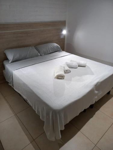 Postel nebo postele na pokoji v ubytování Grace Apartaments