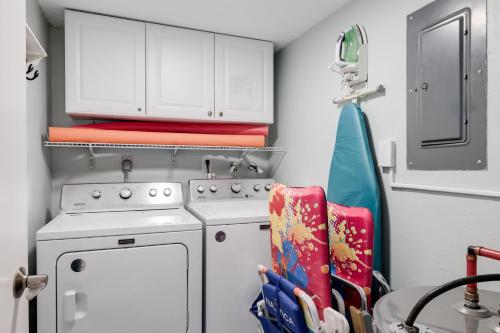 a small kitchen with a stove and a white oven at Breakers West C2 - Gorgeous Top Floor Beach Condo in Sanibel