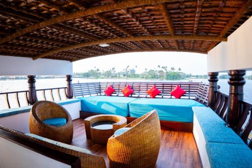 a bed on the back of a boat at Why Not Houseboat in Alleppey