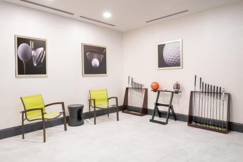 a room with chairs and pictures on the wall at Springhill Suites by Marriott Conyers in Conyers