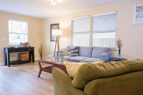 a living room with a couch and a table at House near Tampa Zoo and Busch Gardens, free high speed wifi in Tampa