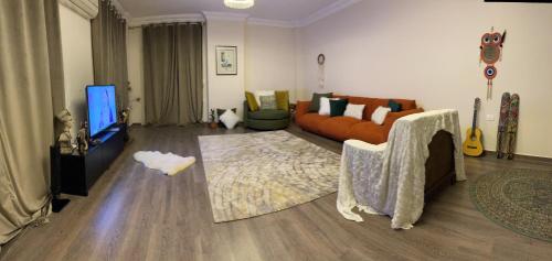 Телевизор и/или развлекательный центр в COMFY HOUSE