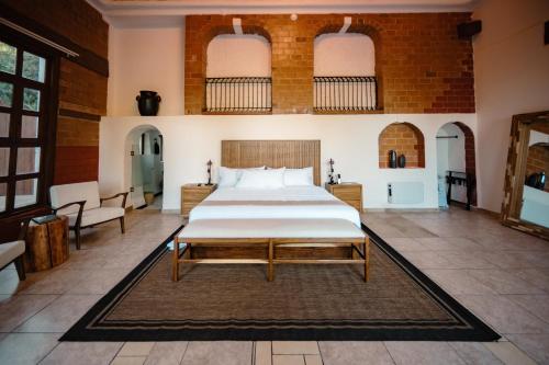 a large bedroom with a large bed in a room at BOTANIQ HOTEL BOUTIQUE in Valle de Bravo