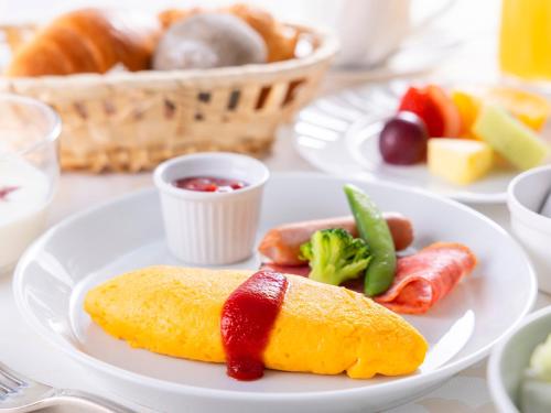 a white plate with food on a table at Nagasaki International Hotel in Omura