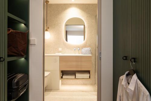 a bathroom with a sink and a mirror at Element Wroclaw in Wrocław