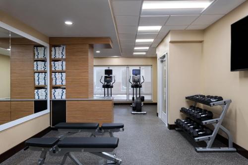 a fitness room with treadmills and weights at TownePlace Suites by Marriott Edgewood Aberdeen in Belcamp
