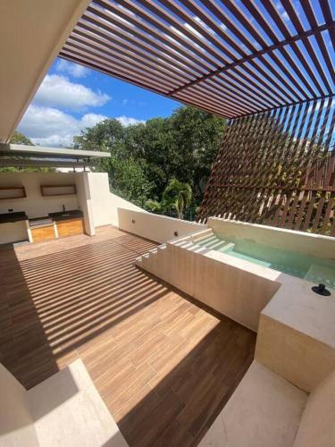 a view of a deck with a pool in a house at ¡New Villa 4BR with priv jacuzzi! in Tulum
