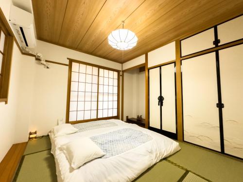 Кровать или кровати в номере X101Near Nagoya Station detached house11 people
