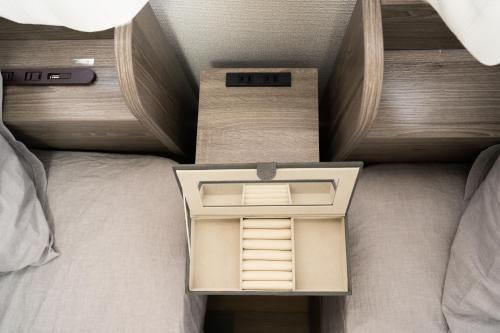 a bed with a box on top of it at X101Near Nagoya Station detached hous 12 people in Nagoya